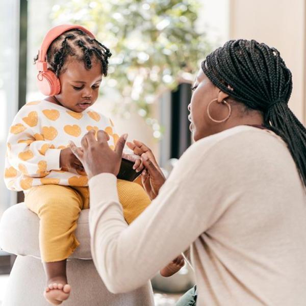 Speech an language thereapy with a teacher and a young student